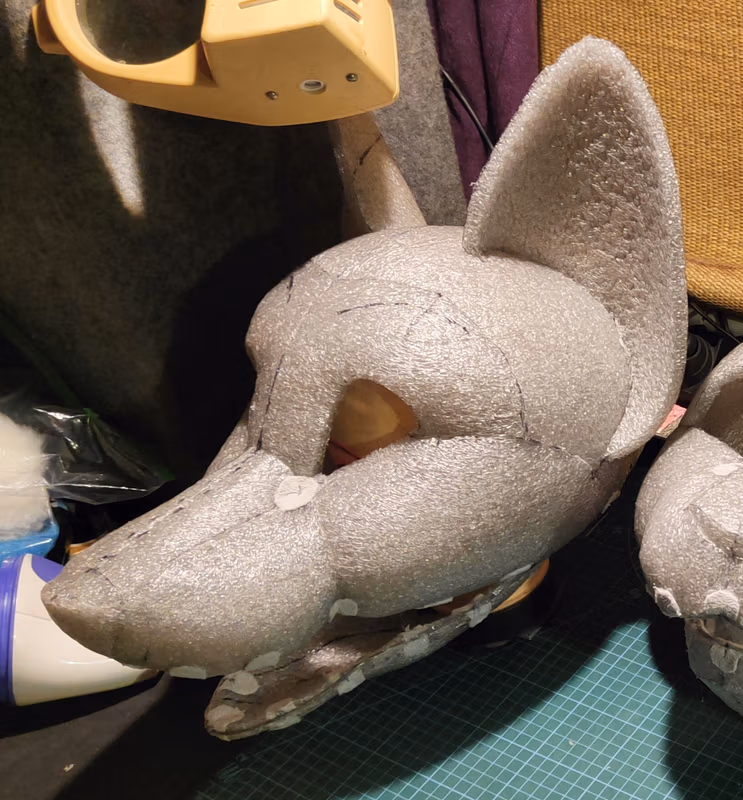 Photo of the production of the fursuit's head and its parts.