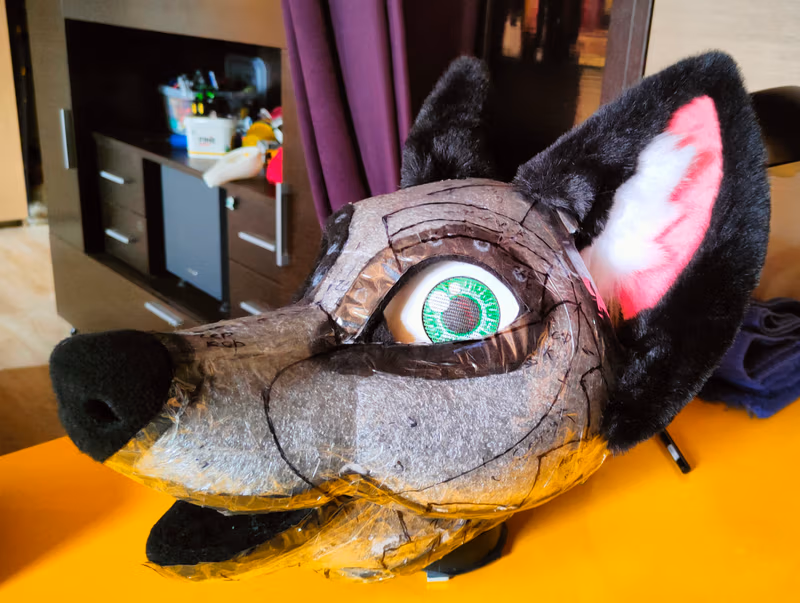 Photo of the production of the fursuit's head and its parts.